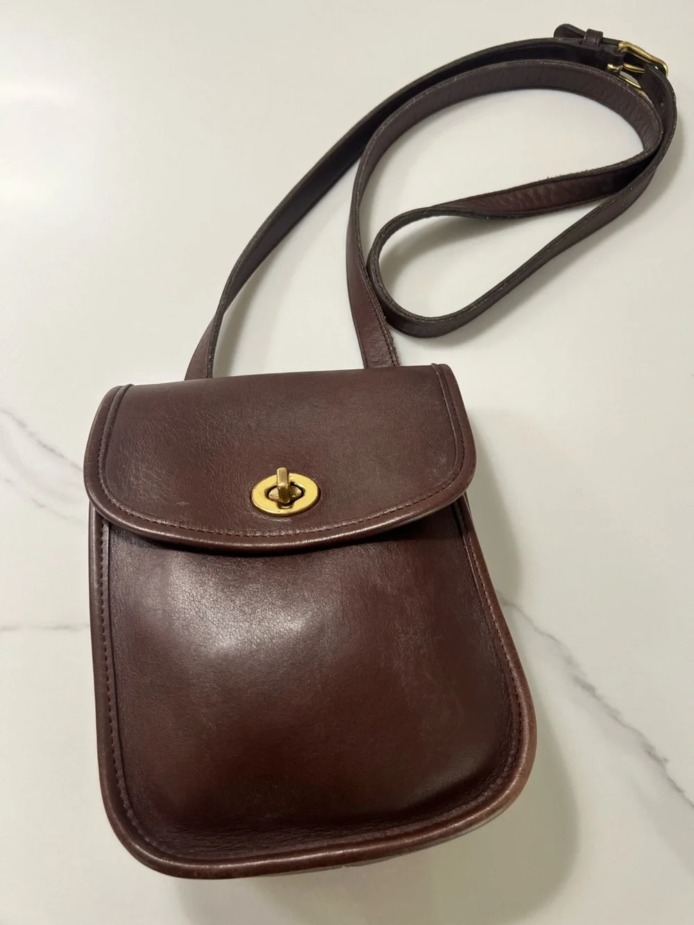 Vintage Coach Brown Leather Crossbody Bag with Gold Hardware.